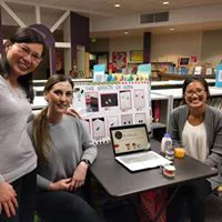 Dr. Tina Le and team at a booth during a community event