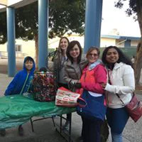 Dr. Tina Le and a team of people at an outdoor event