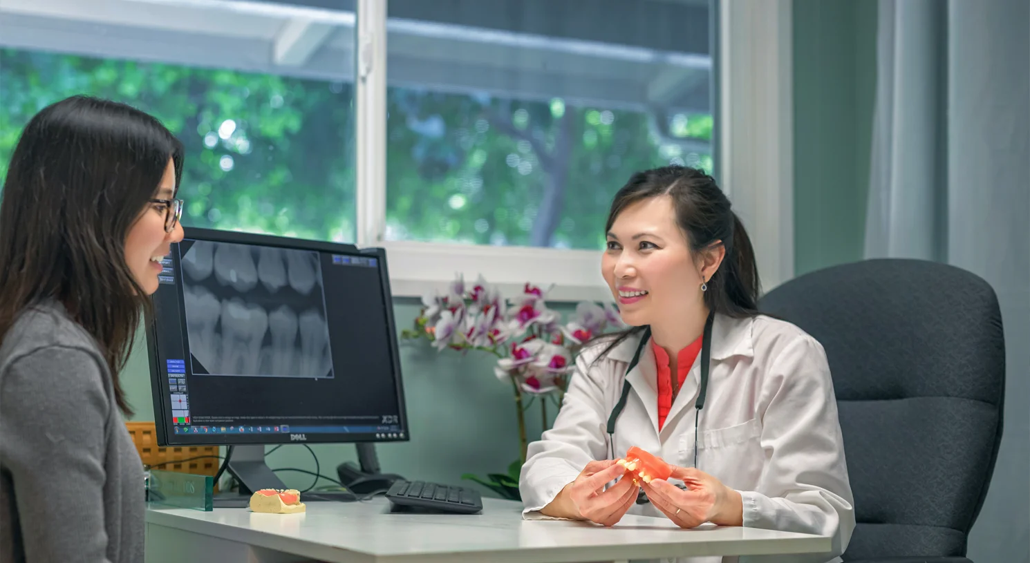 Dr. Tina Le and a patient sitting in the office during a consultation